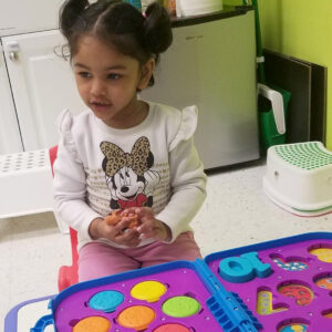 Young girl learning her numbers