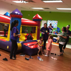 Kids playing in a bouncy house