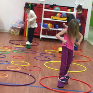 Students playing with hula hoops